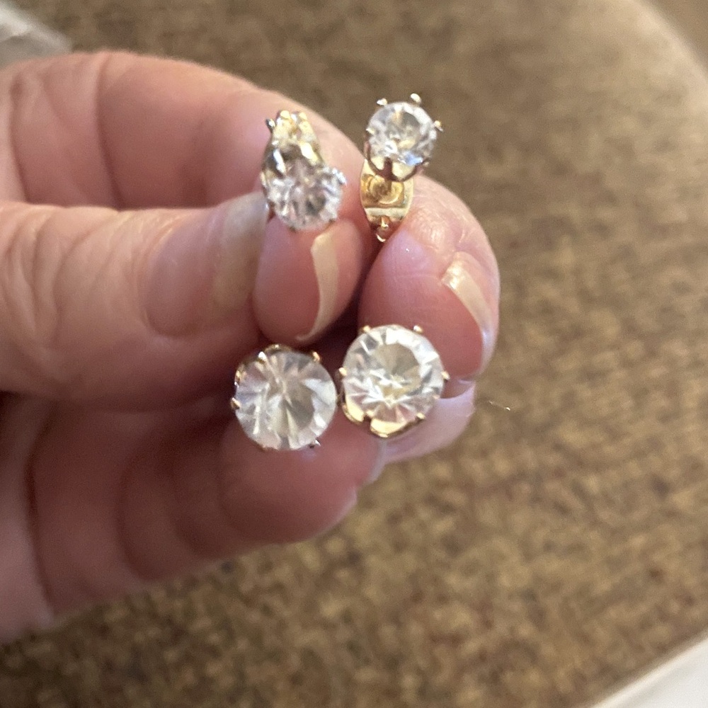 Cubic zirconia diamond earrings upper and floating lower stone design.